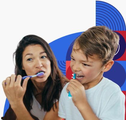 A woman and child brushing their teeth.