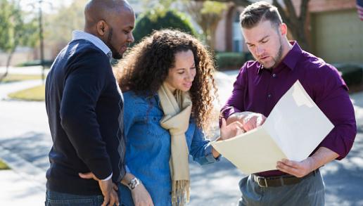 Three people looking over a document together