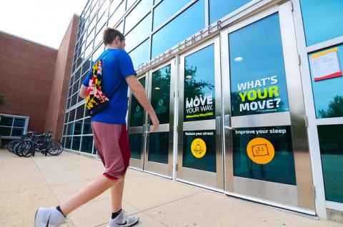 Image of a student walking into the recreation center.